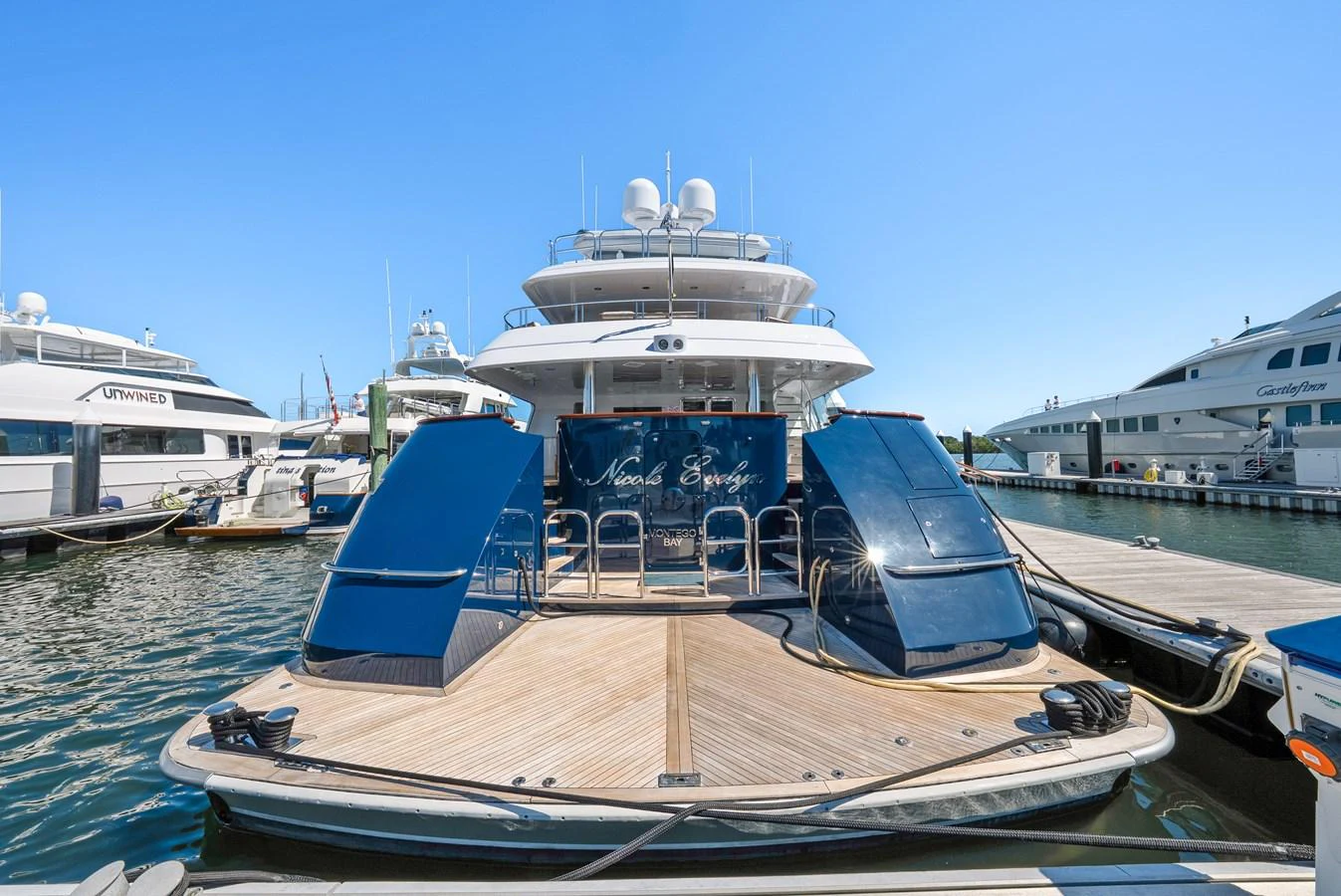 a large white boat sits in the water aboard NICOLE EVELYN Yacht for Sale