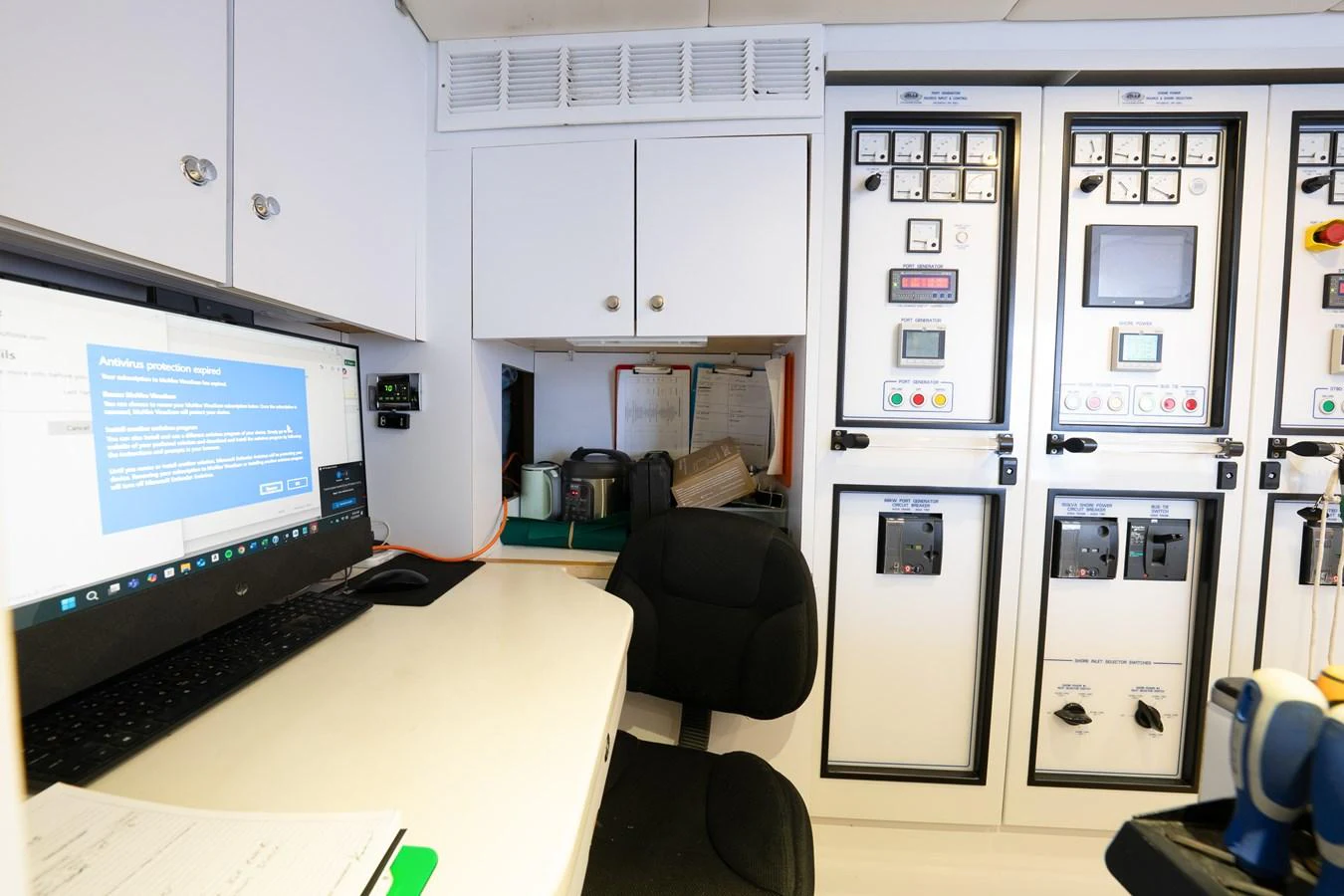 a room with a computer and a desk aboard NICOLE EVELYN Yacht for Sale