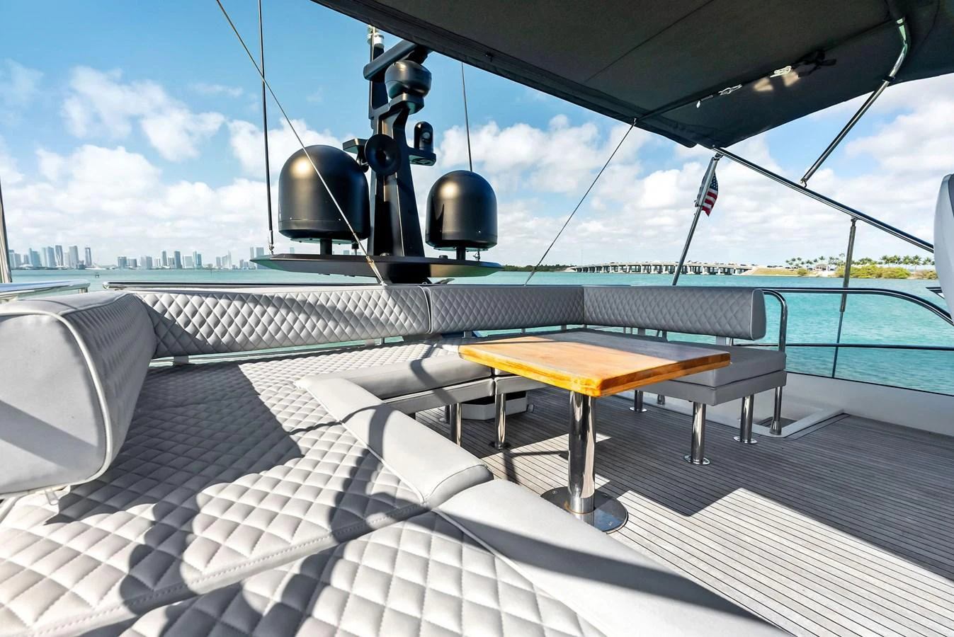 The flybridge offers a spacious and luxurious seating area with a stunning view of the water. aboard PANDA Yacht for Sale