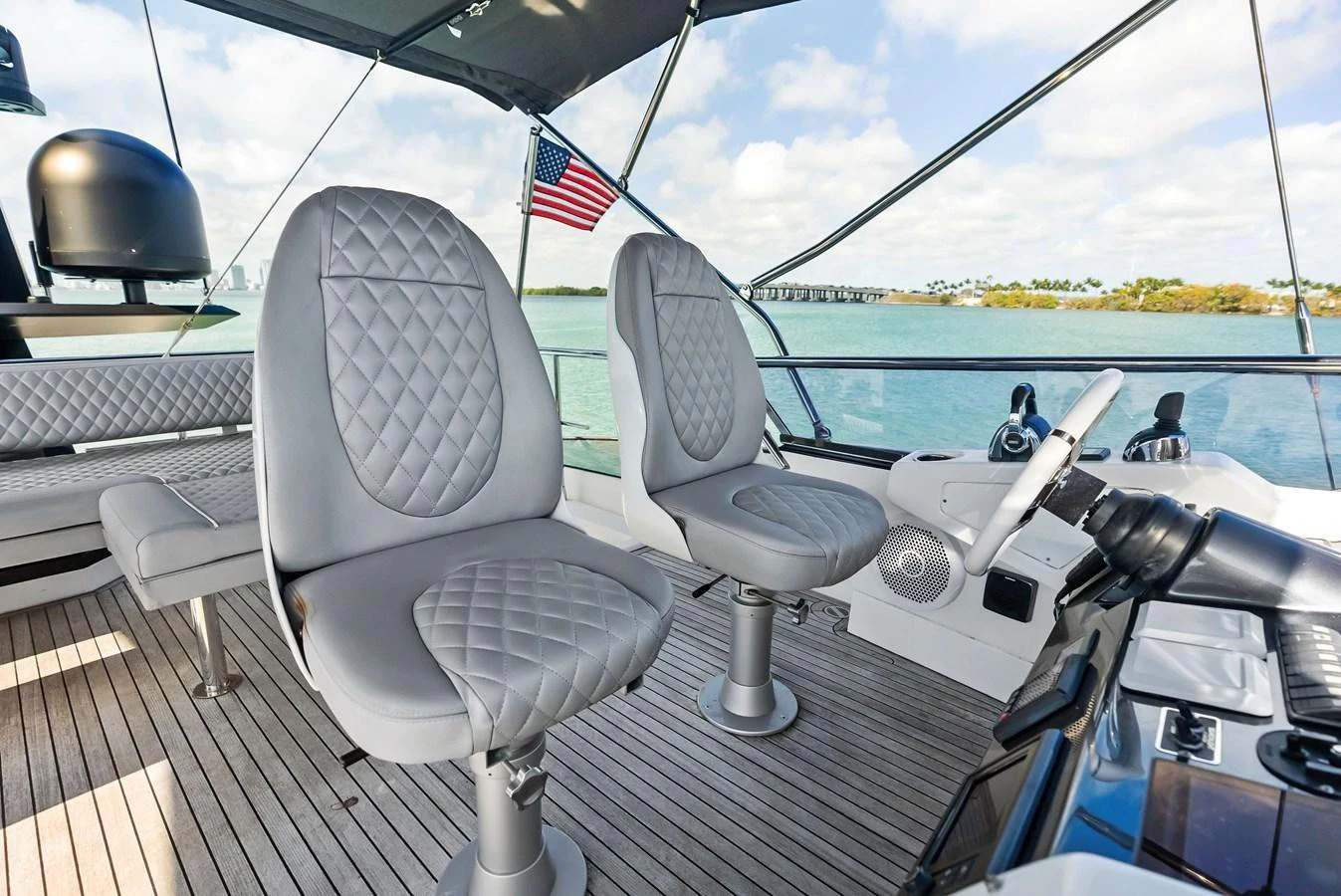 The flybridge offers a comfortable and stylish seating area with a panoramic view of the water. aboard PANDA Yacht for Sale
