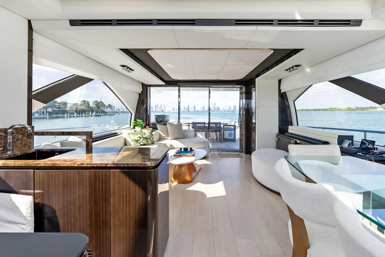 The salon offers a spacious and luxurious setting with panoramic views and elegant furnishings. aboard PANDA Yacht for Sale