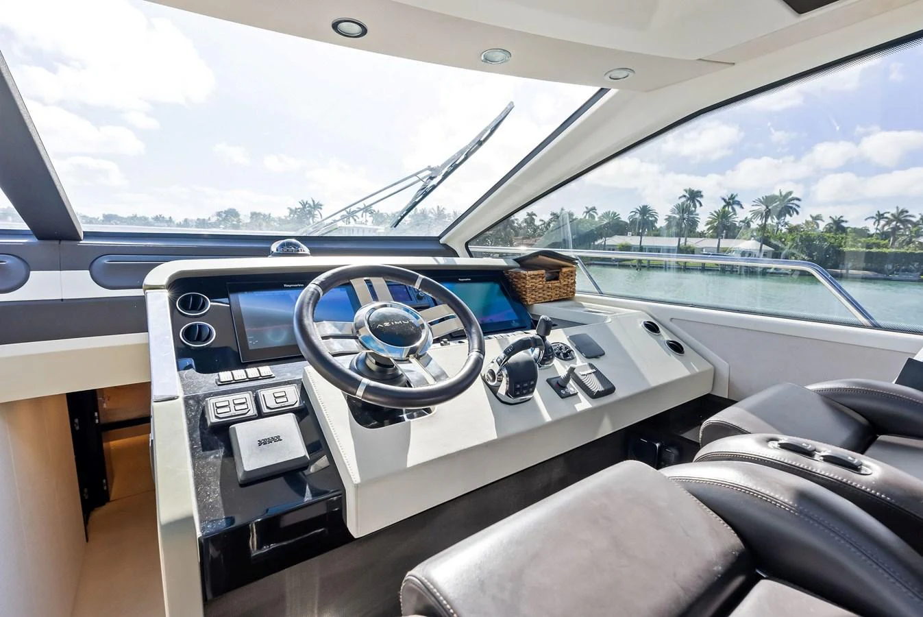 The helm of this yacht offers a sleek and modern control center with a panoramic view. aboard PANDA Yacht for Sale
