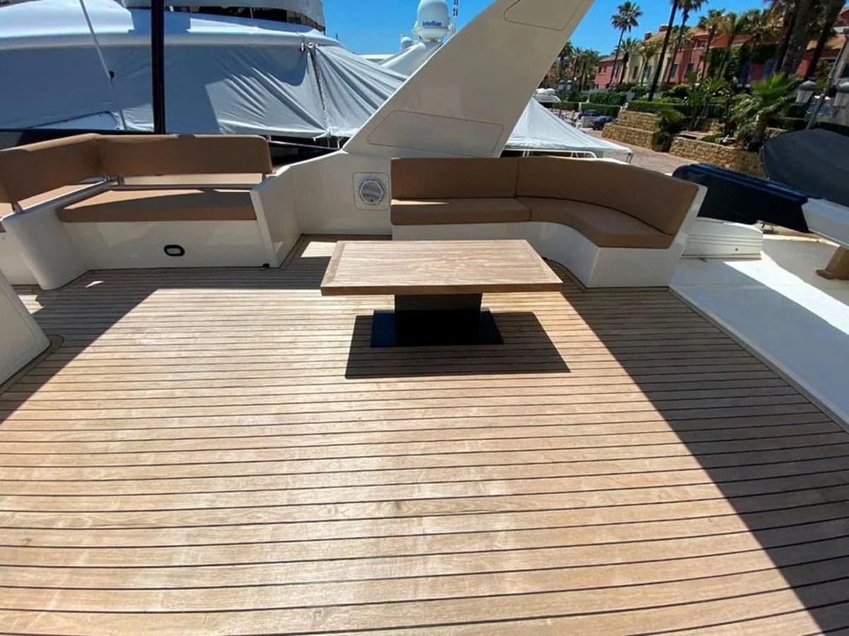 a wood deck with a wood railing aboard YAIZA Yacht for Sale