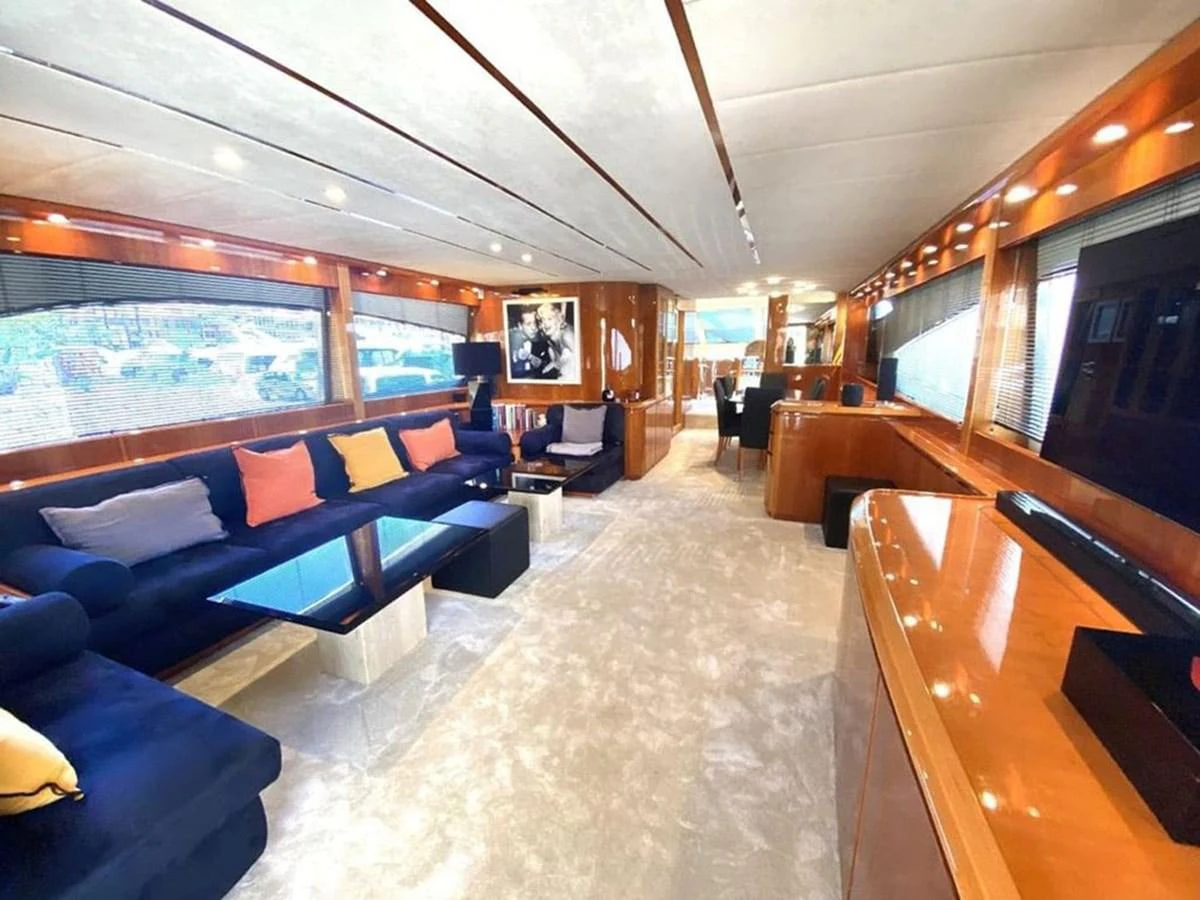 a room with a couch and a table and chairs aboard YAIZA Yacht for Sale