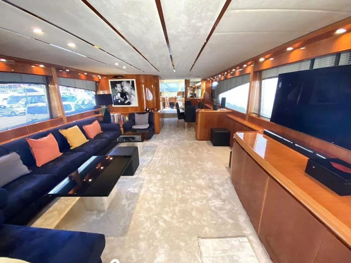 a large living room with a large screen aboard YAIZA Yacht for Sale