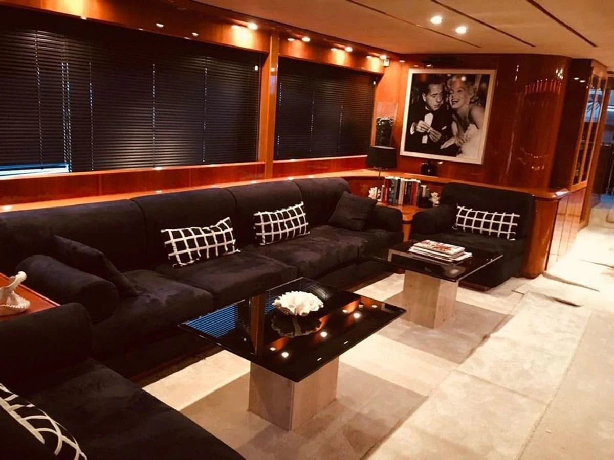 a living room with a piano aboard YAIZA Yacht for Sale