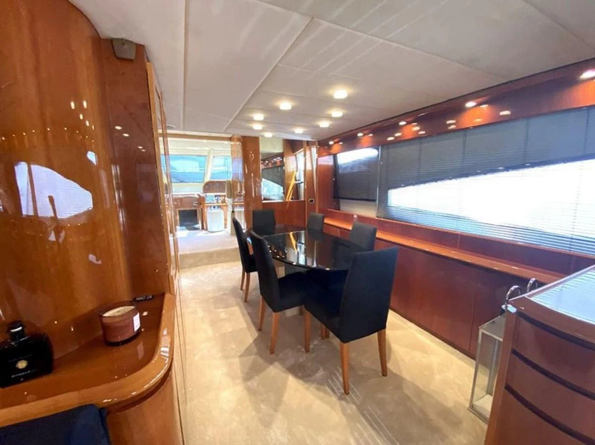 a room with a table and chairs aboard YAIZA Yacht for Sale