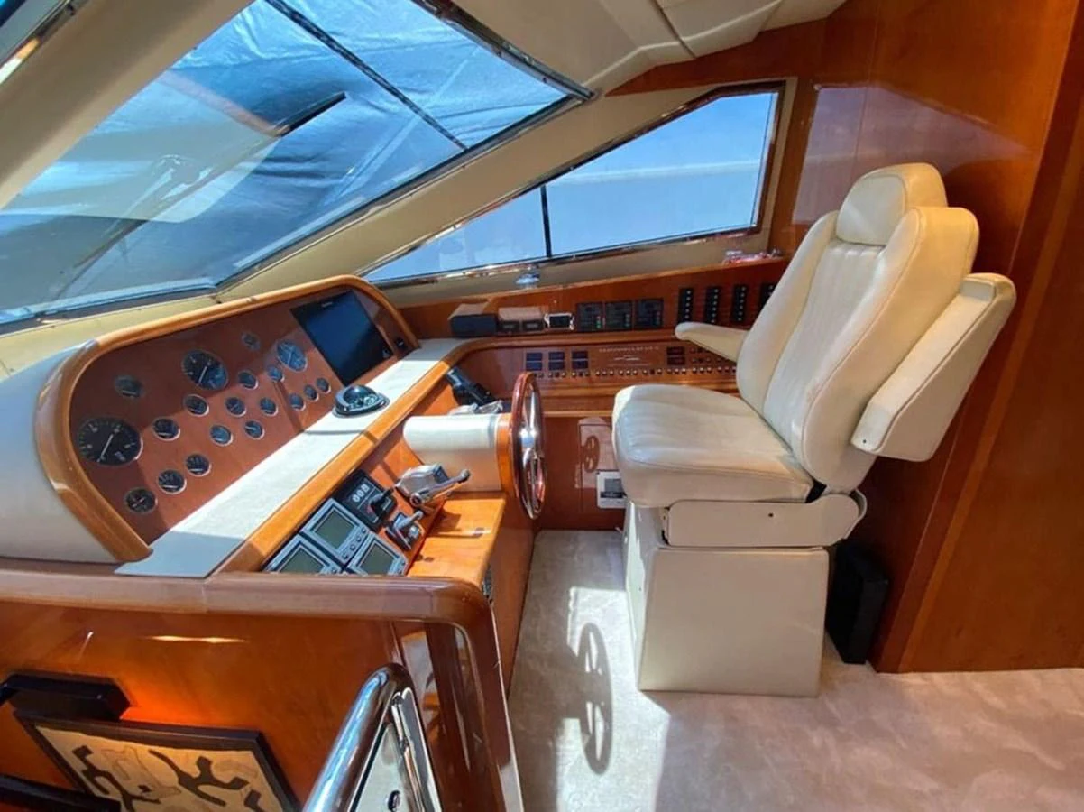 a room with a chair and a desk with a laptop on it aboard YAIZA Yacht for Sale