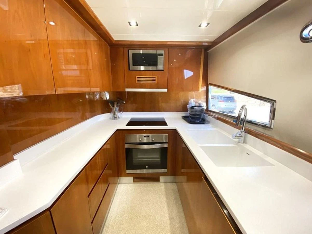 a kitchen with a large island aboard YAIZA Yacht for Sale