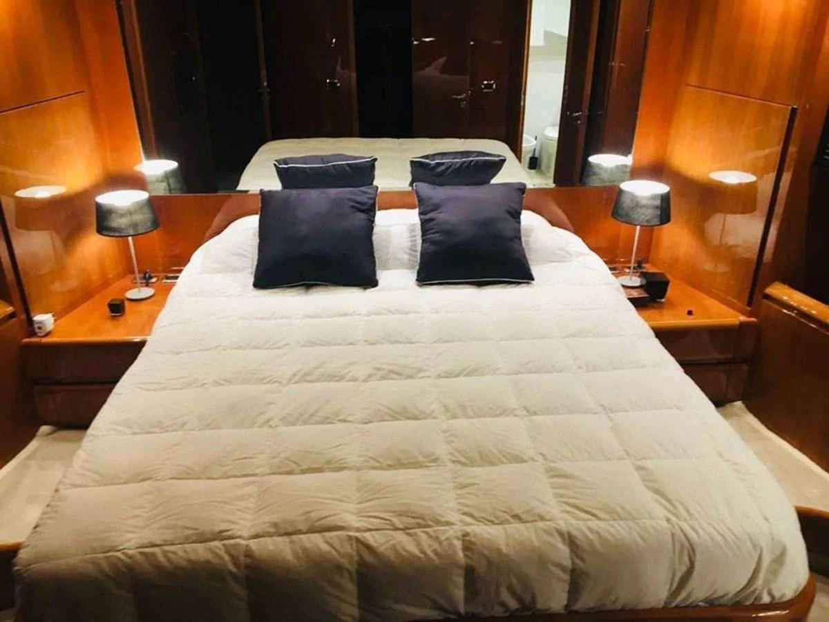 a bed with pillows aboard YAIZA Yacht for Sale