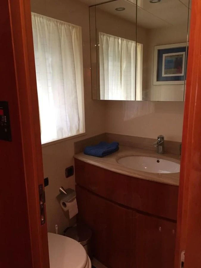 a bathroom with red walls aboard YAIZA Yacht for Sale