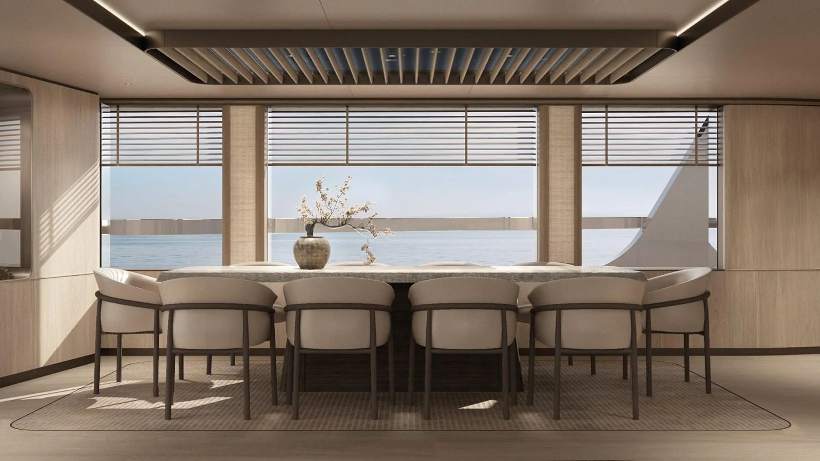 The yacht's dining area features a large table with elegant seating and panoramic windows offering stunning sea views. aboard BERSERK 47 Yacht for Sale