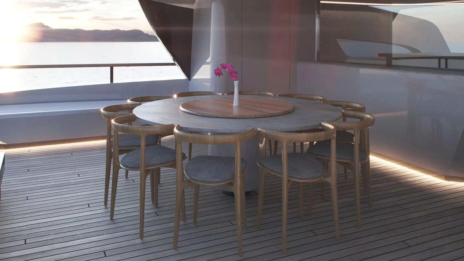The aft deck features a stylish round dining table with elegant wooden chairs, perfect for alfresco dining. aboard BERSERK 47 Yacht for Sale