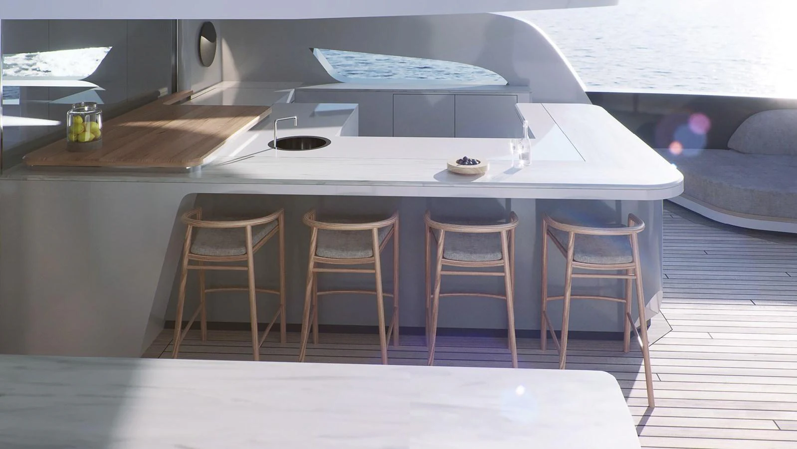 This image showcases a sleek outdoor bar area with modern seating and a serene ocean backdrop. aboard BERSERK 47 Yacht for Sale