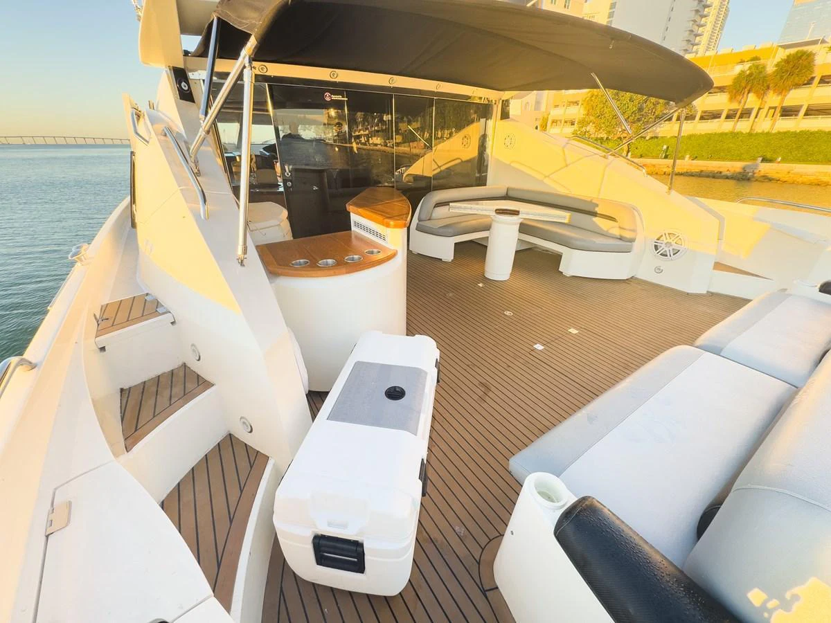 The aft deck offers a spacious and inviting area for relaxation and entertainment with comfortable seating and a sleek design. aboard THE GAMBLER Yacht for Sale
