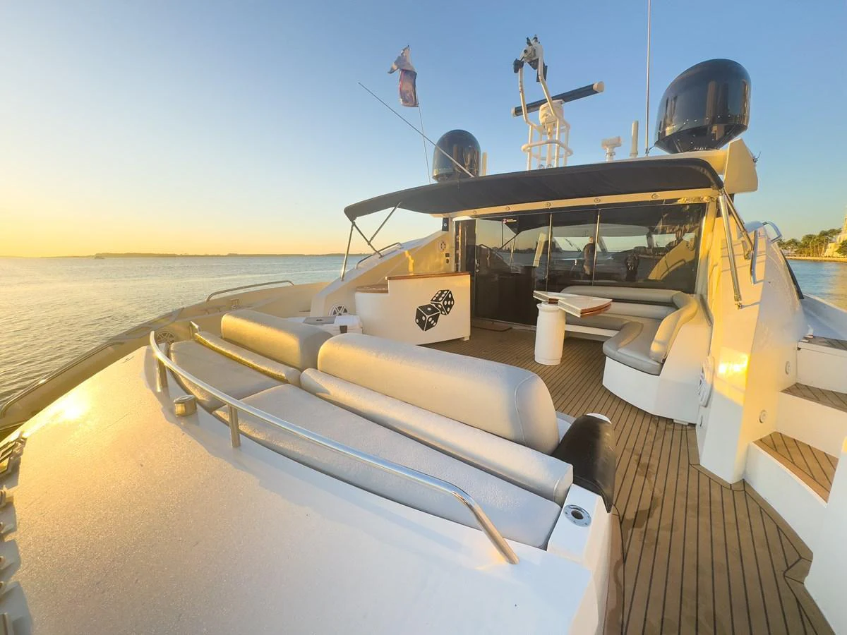 The yacht's aft deck offers a spacious and inviting area for relaxation and socializing, with comfortable seating and a beautiful view of the water. aboard THE GAMBLER Yacht for Sale