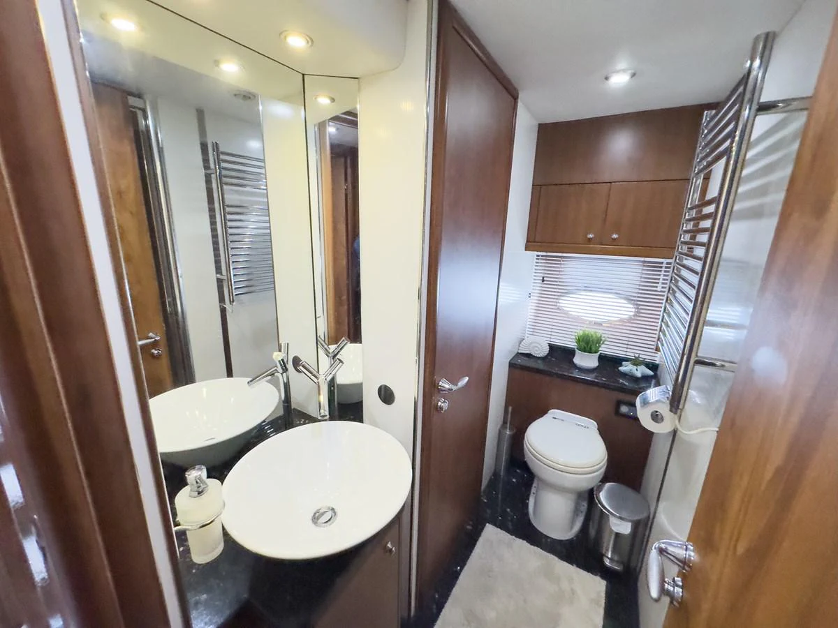 The yacht's bathroom features modern fixtures and a sleek design. aboard THE GAMBLER Yacht for Sale