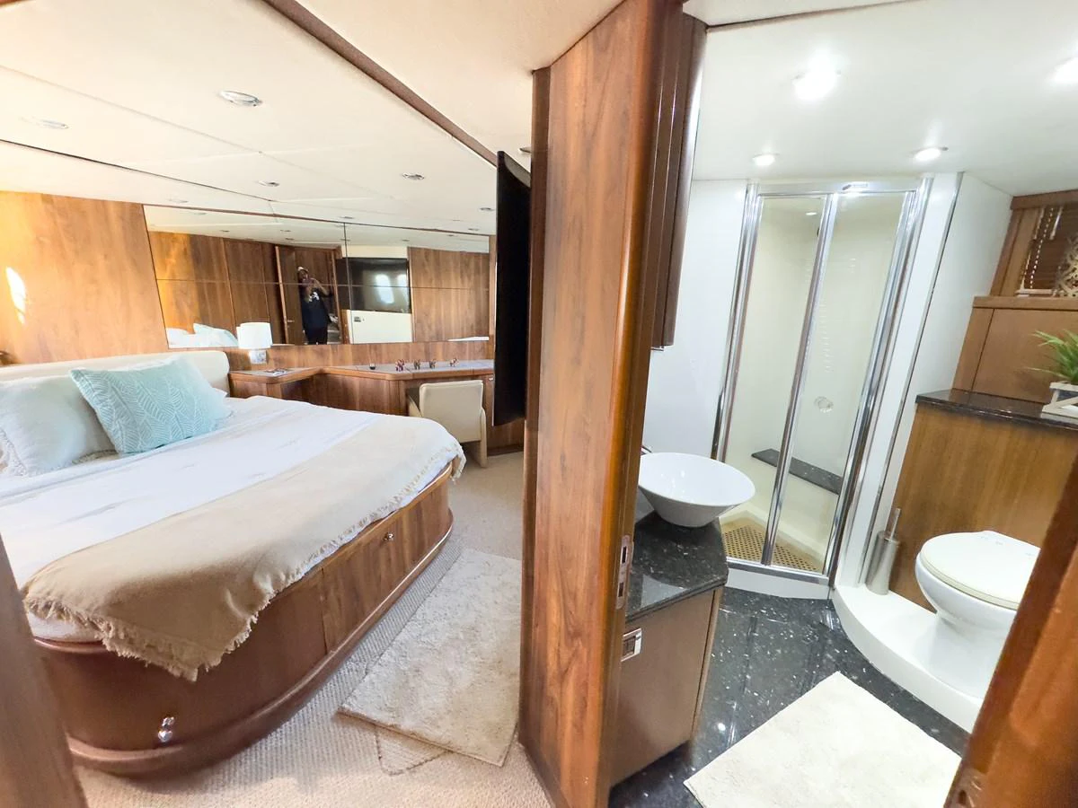 The master stateroom features a spacious bed and an ensuite bathroom with modern amenities. aboard THE GAMBLER Yacht for Sale