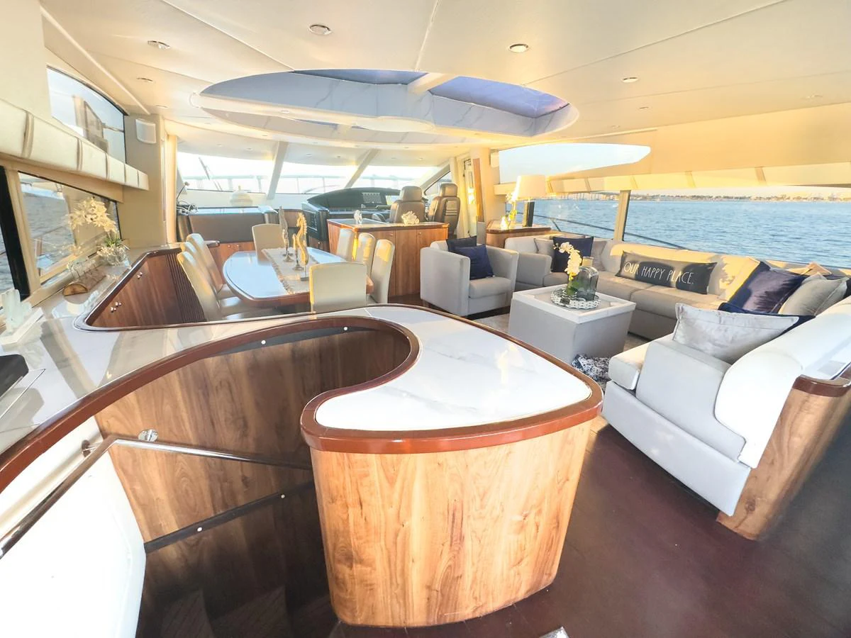 The salon features luxurious seating with panoramic views and elegant decor. aboard THE GAMBLER Yacht for Sale