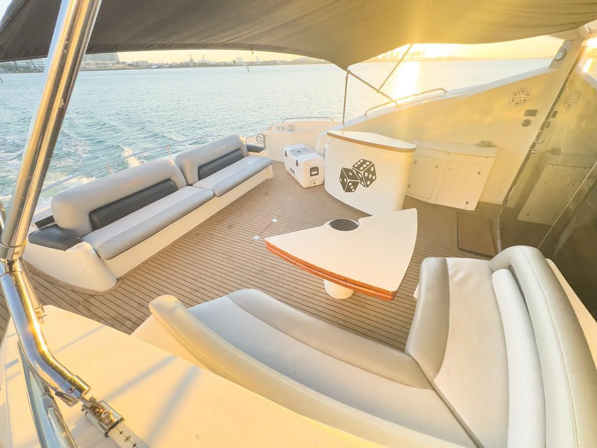The aft deck offers a spacious and comfortable seating area with a stunning view of the water. aboard THE GAMBLER Yacht for Sale
