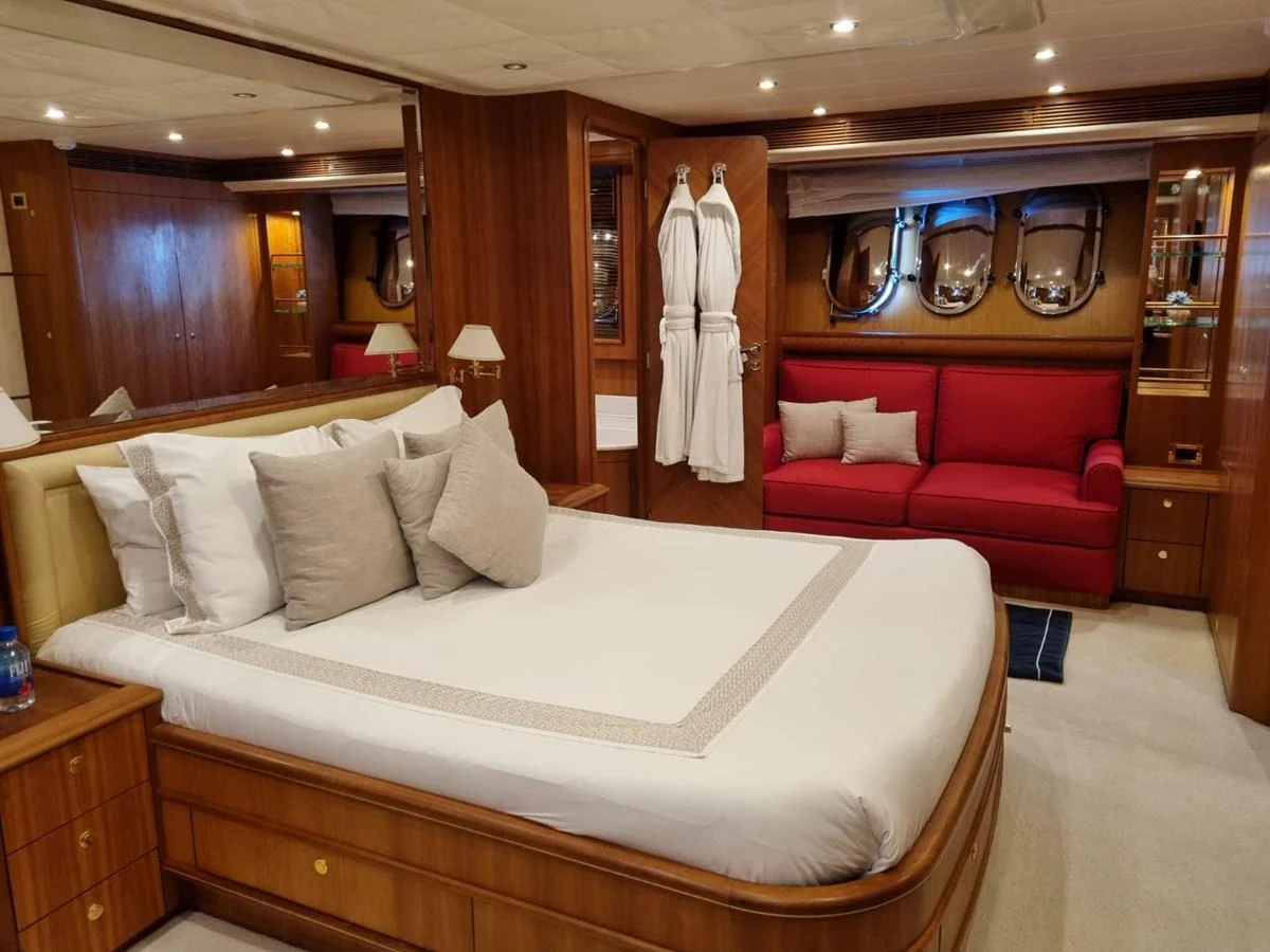 a bed in a hotel room aboard LADY AMANDA Yacht for Sale