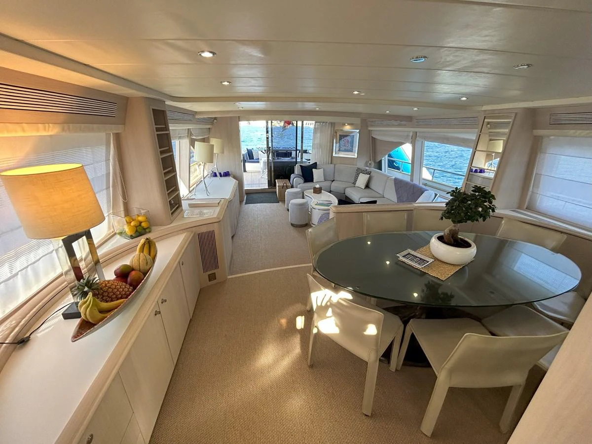 a modern looking kitchen with a large table and chairs aboard LADY AMANDA Yacht for Sale