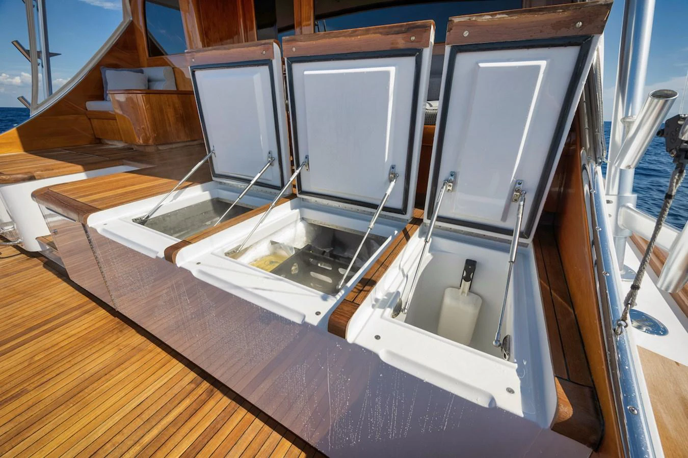 The yacht features spacious deck storage compartments with elegant wooden finishes. aboard BREE Yacht for Sale