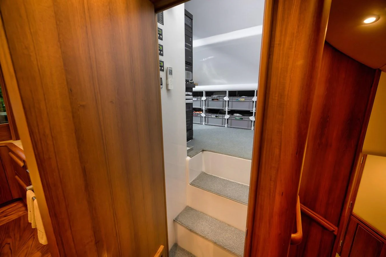 A view of the yacht's interior showing a staircase leading to a technical or storage area. aboard BREE Yacht for Sale