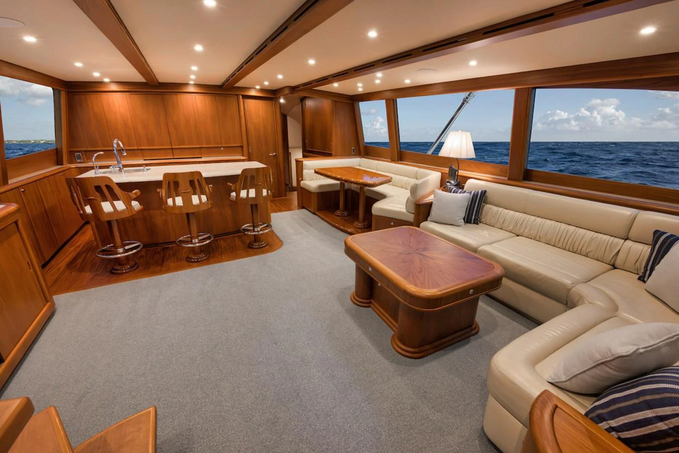 The yacht's salon features a spacious and elegant seating area with ample natural light and ocean views. aboard BREE Yacht for Sale