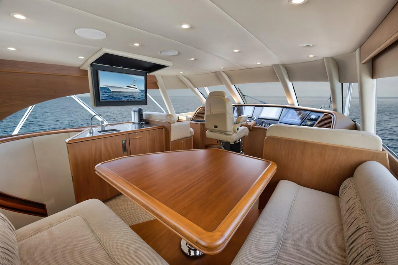 The salon offers a spacious and elegant setting with panoramic views and luxurious seating. aboard BREE Yacht for Sale