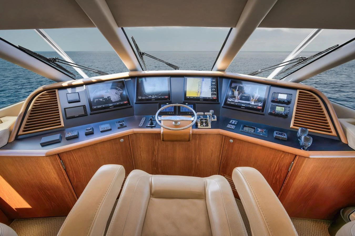 The helm station offers a commanding view with state-of-the-art navigation equipment and luxurious seating. aboard BREE Yacht for Sale