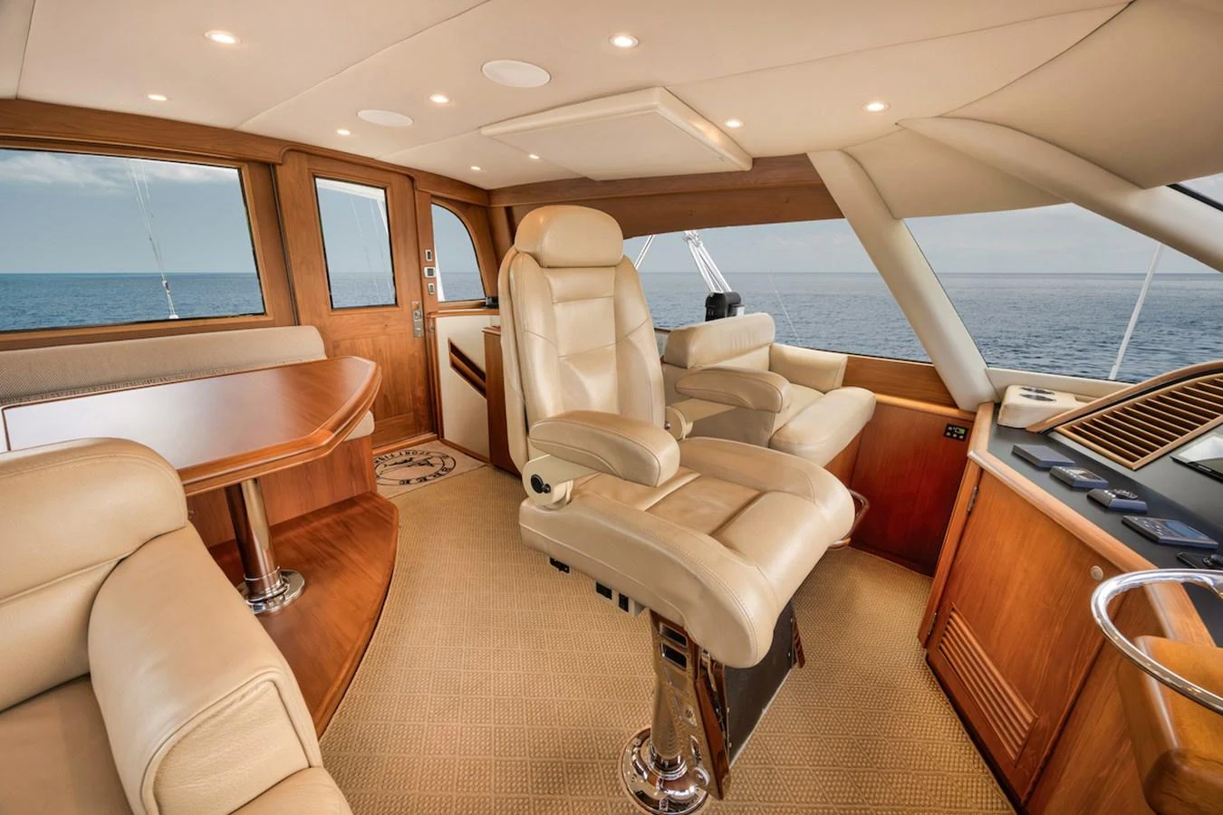 The helm station features luxurious leather seating and expansive ocean views. aboard BREE Yacht for Sale