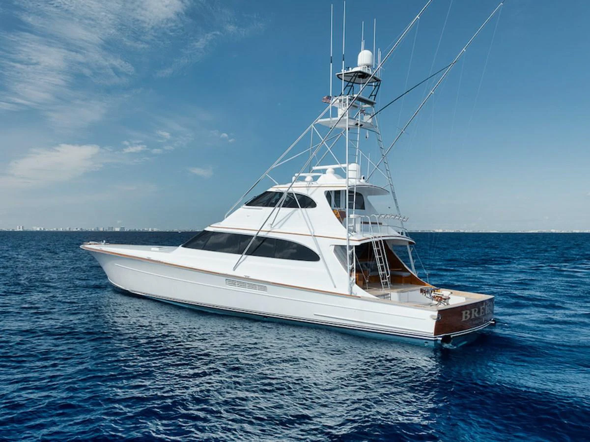 A sleek and elegant yacht glides effortlessly on the open sea under a clear blue sky. aboard BREE Yacht for Sale