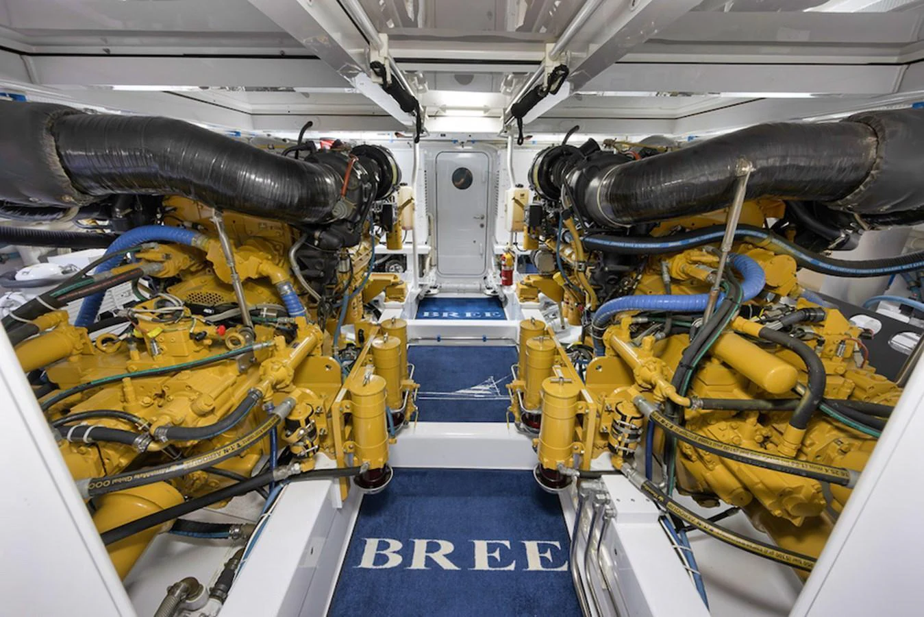 The image showcases the meticulously maintained engine room of the yacht, featuring powerful twin engines. aboard BREE Yacht for Sale