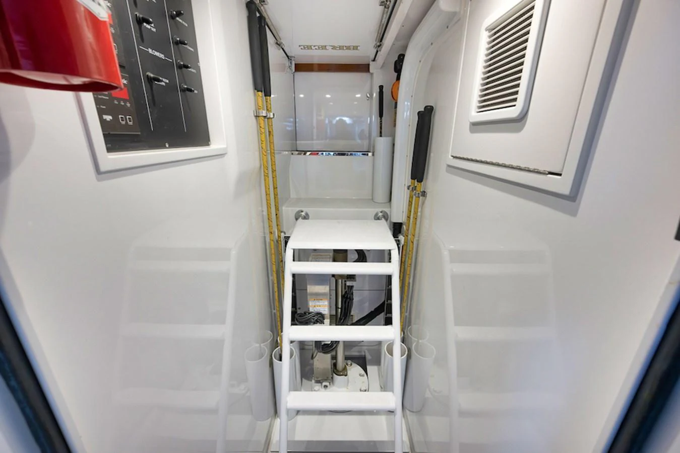 A pristine and well-organized technical area with clean white surfaces and essential equipment. aboard BREE Yacht for Sale