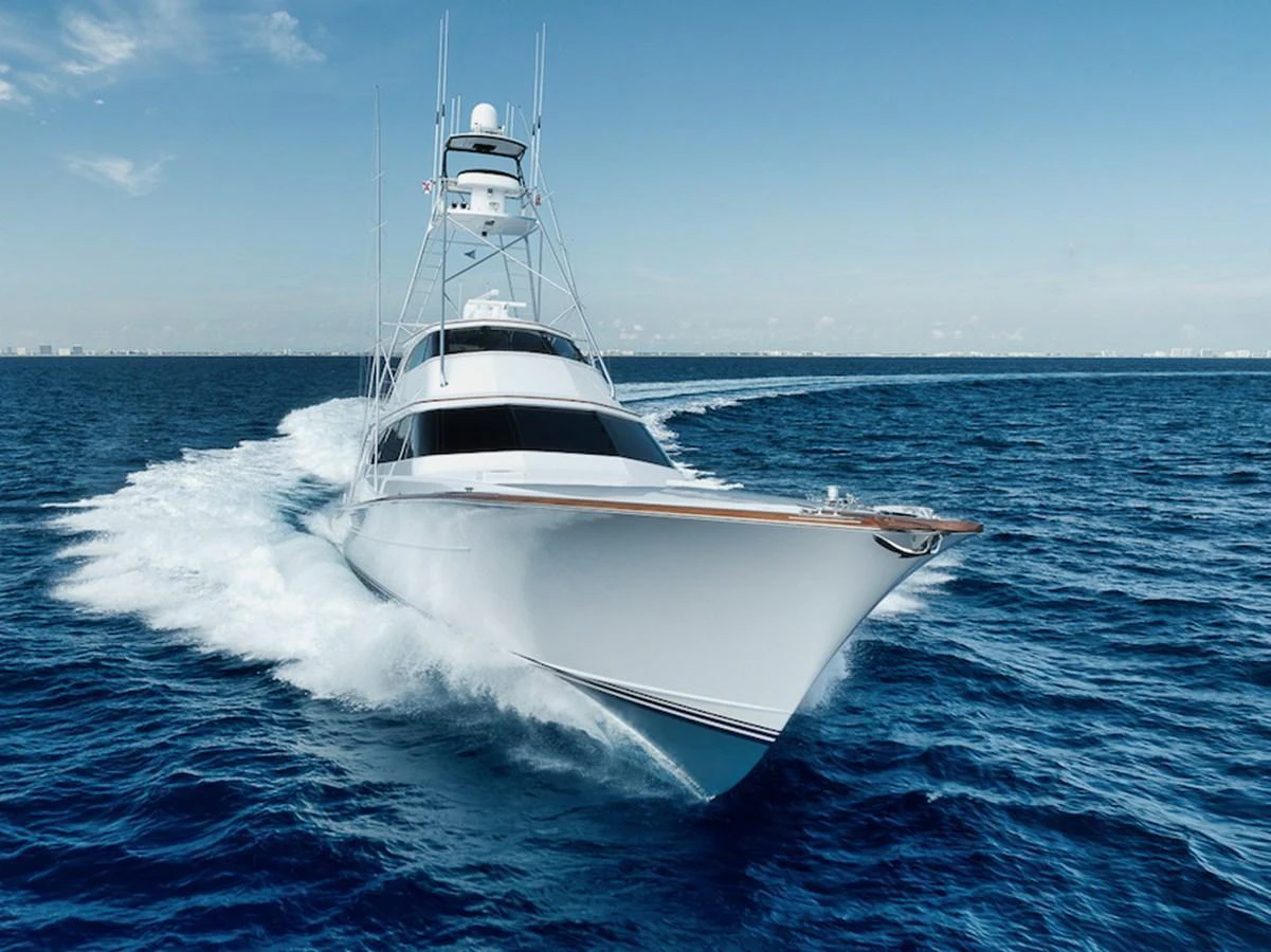 A sleek yacht cuts through the open sea, showcasing its powerful and elegant design. aboard BREE Yacht for Sale