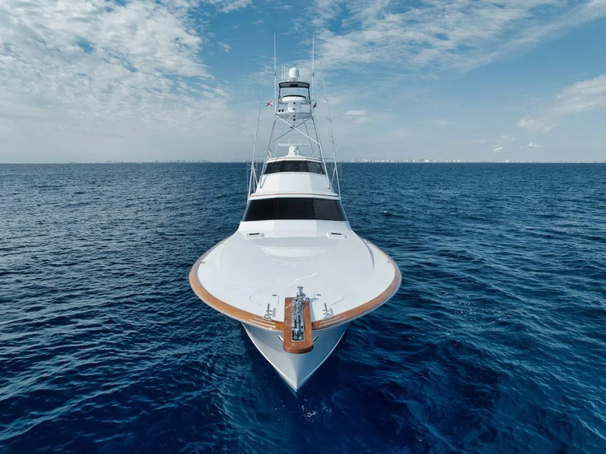A sleek yacht cuts through the open sea, showcasing its impressive bow and modern design. aboard BREE Yacht for Sale