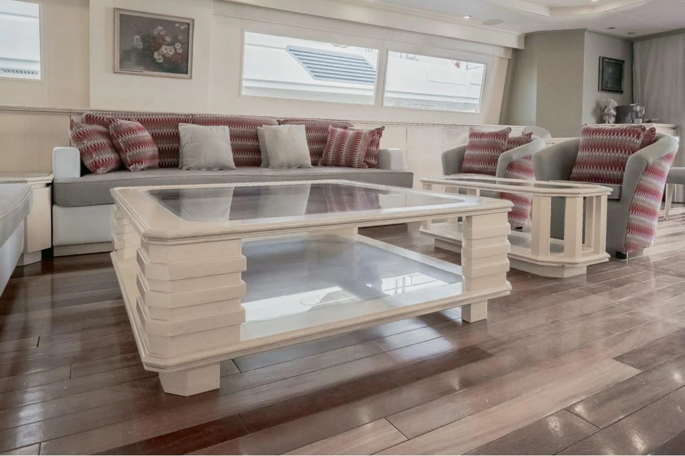 The salon features a stylish seating area with a modern coffee table and plush cushions. aboard PARSLEY Yacht for Sale