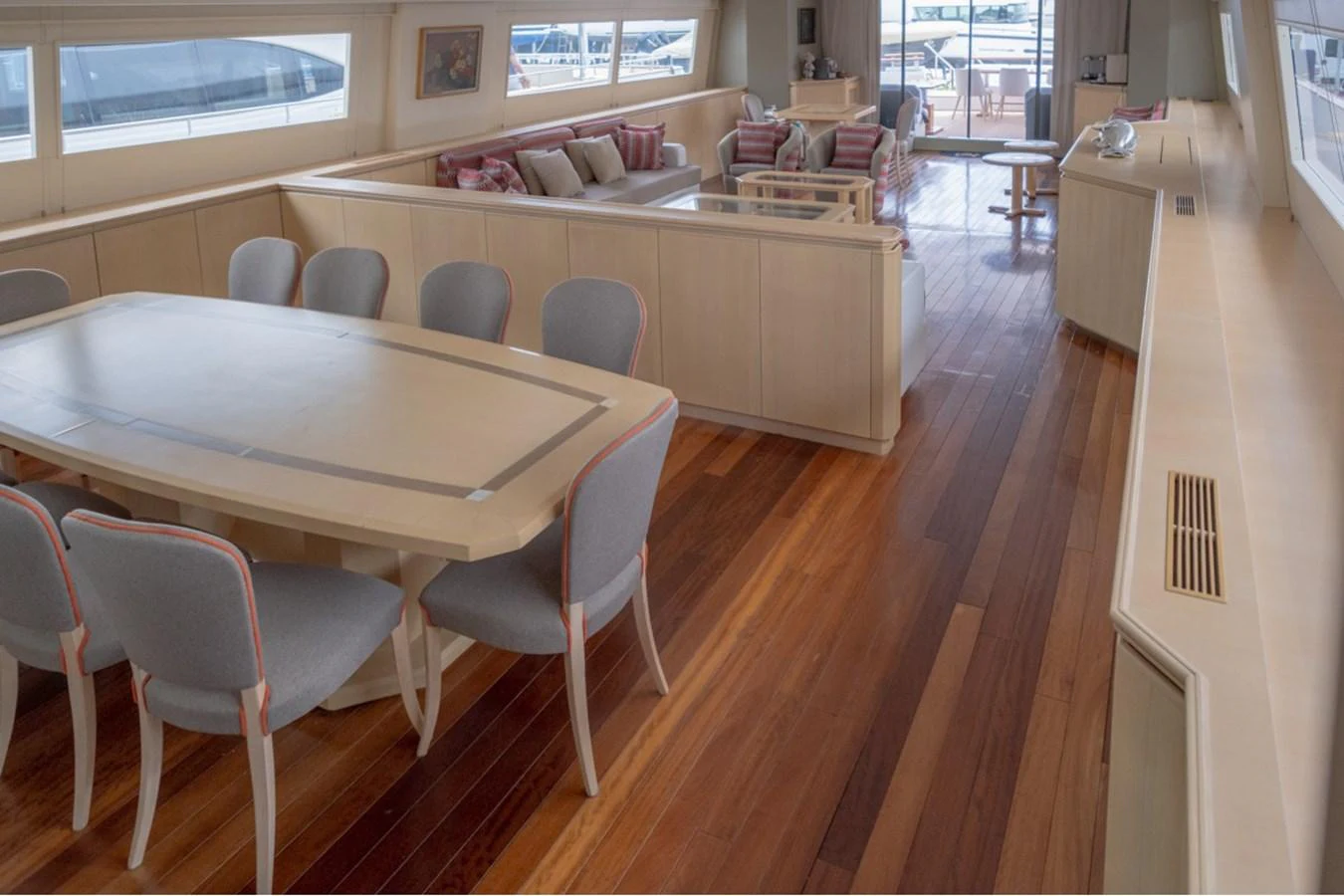 The spacious salon features elegant dining and lounging areas with ample natural light. aboard PARSLEY Yacht for Sale