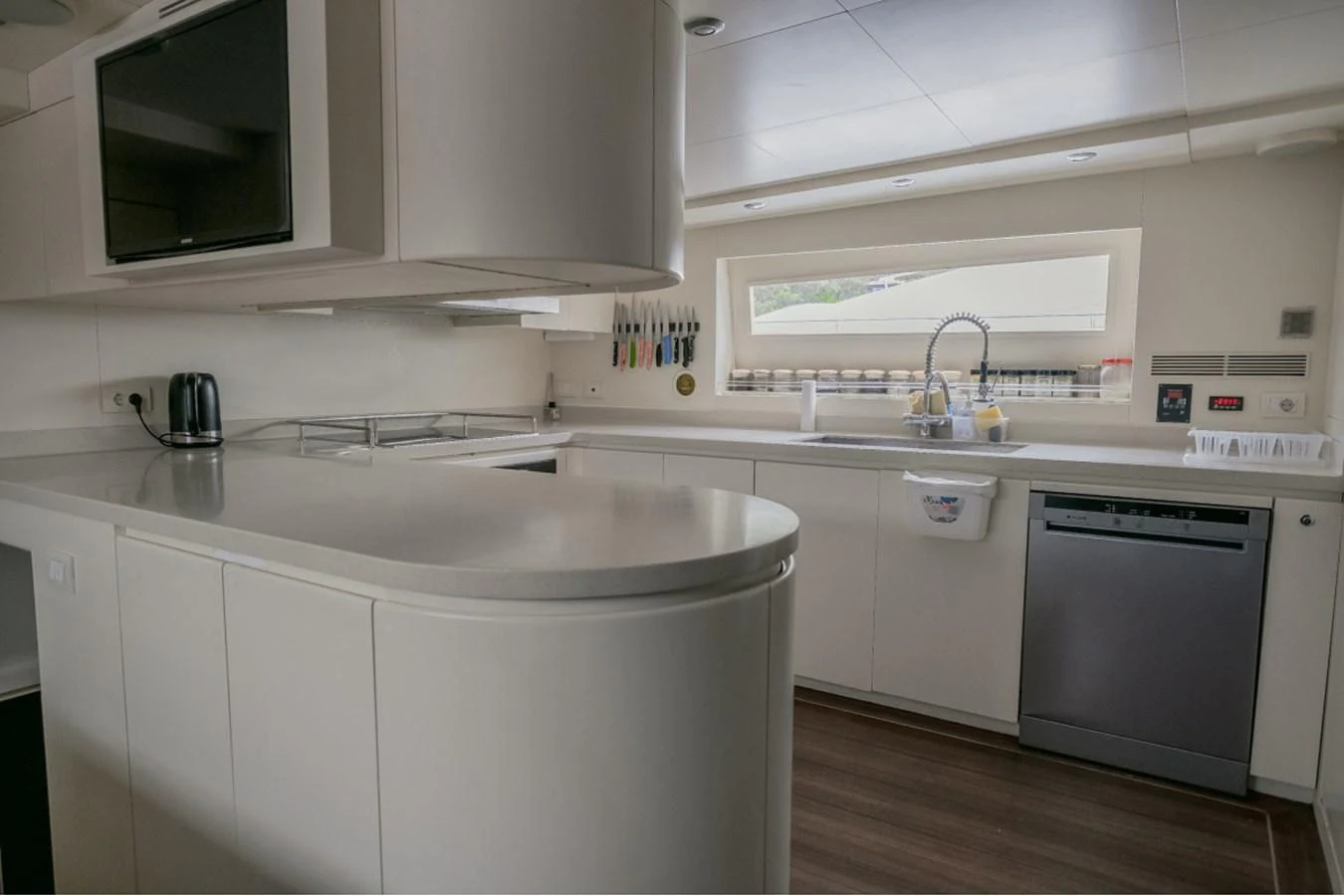 The yacht's galley is equipped with modern appliances and sleek countertops, offering a stylish and functional space for meal preparation. aboard PARSLEY Yacht for Sale