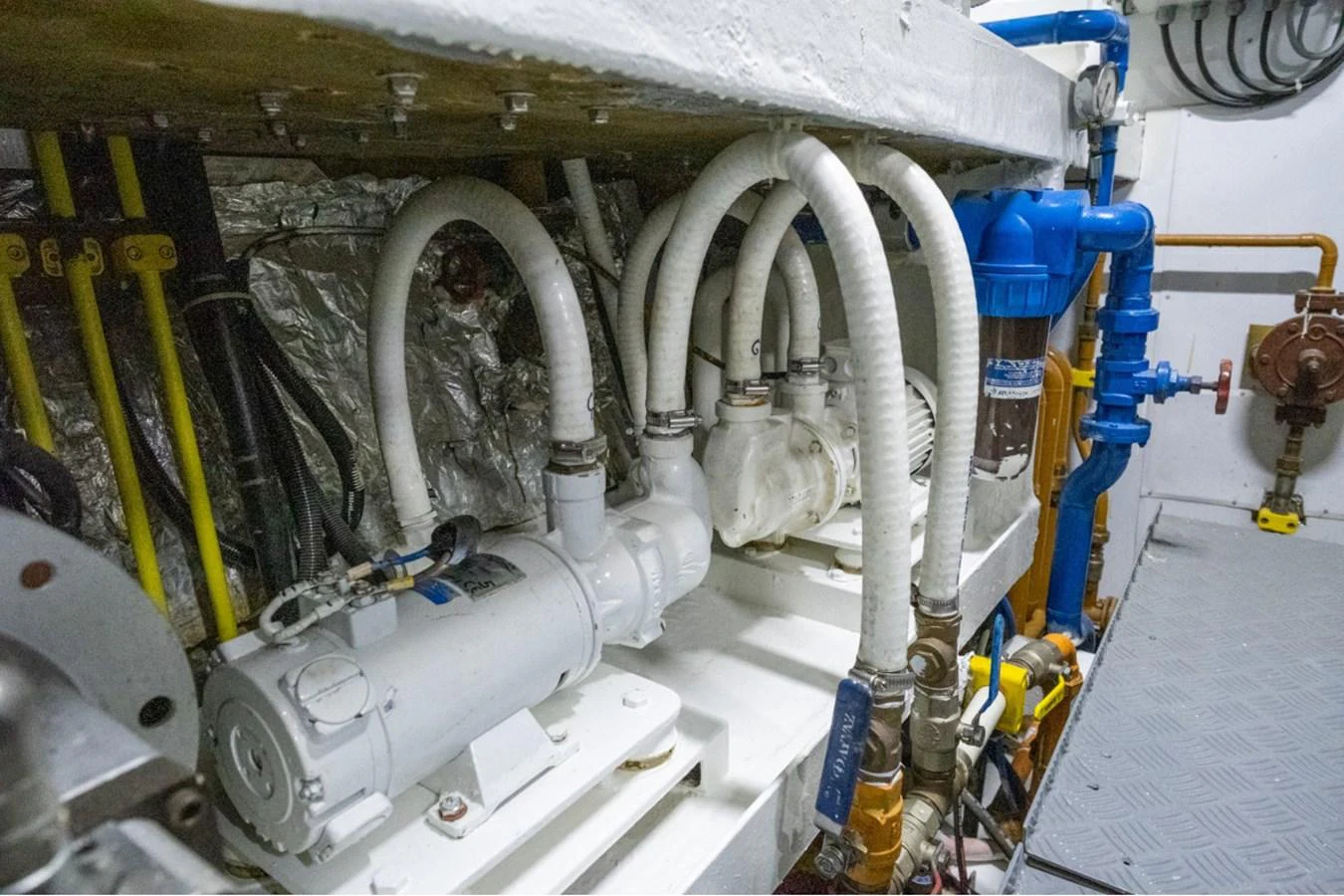 The image showcases the intricate machinery and piping within the yacht's engine room. aboard PARSLEY Yacht for Sale