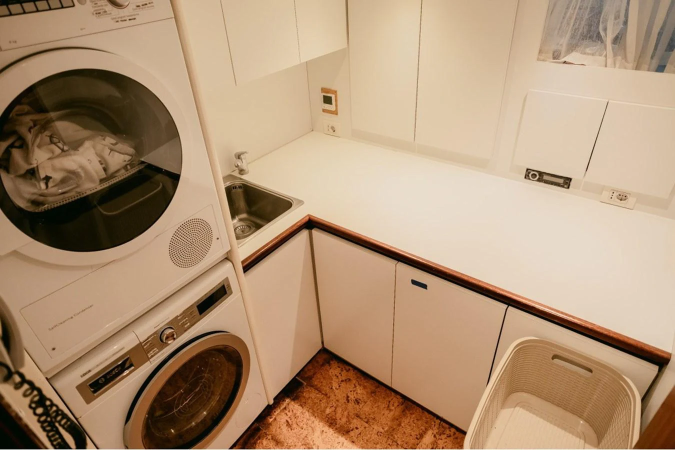 The yacht's laundry room is equipped with modern appliances and ample counter space for convenience. aboard PARSLEY Yacht for Sale