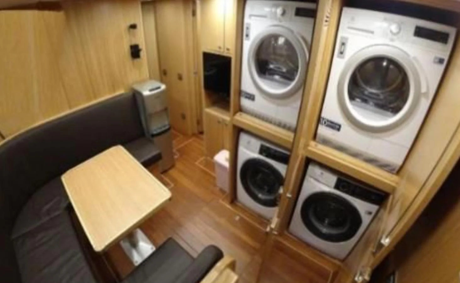 The yacht's laundry room is equipped with modern washers and dryers, providing convenience for extended voyages. aboard RIVA 115 Yacht for Sale