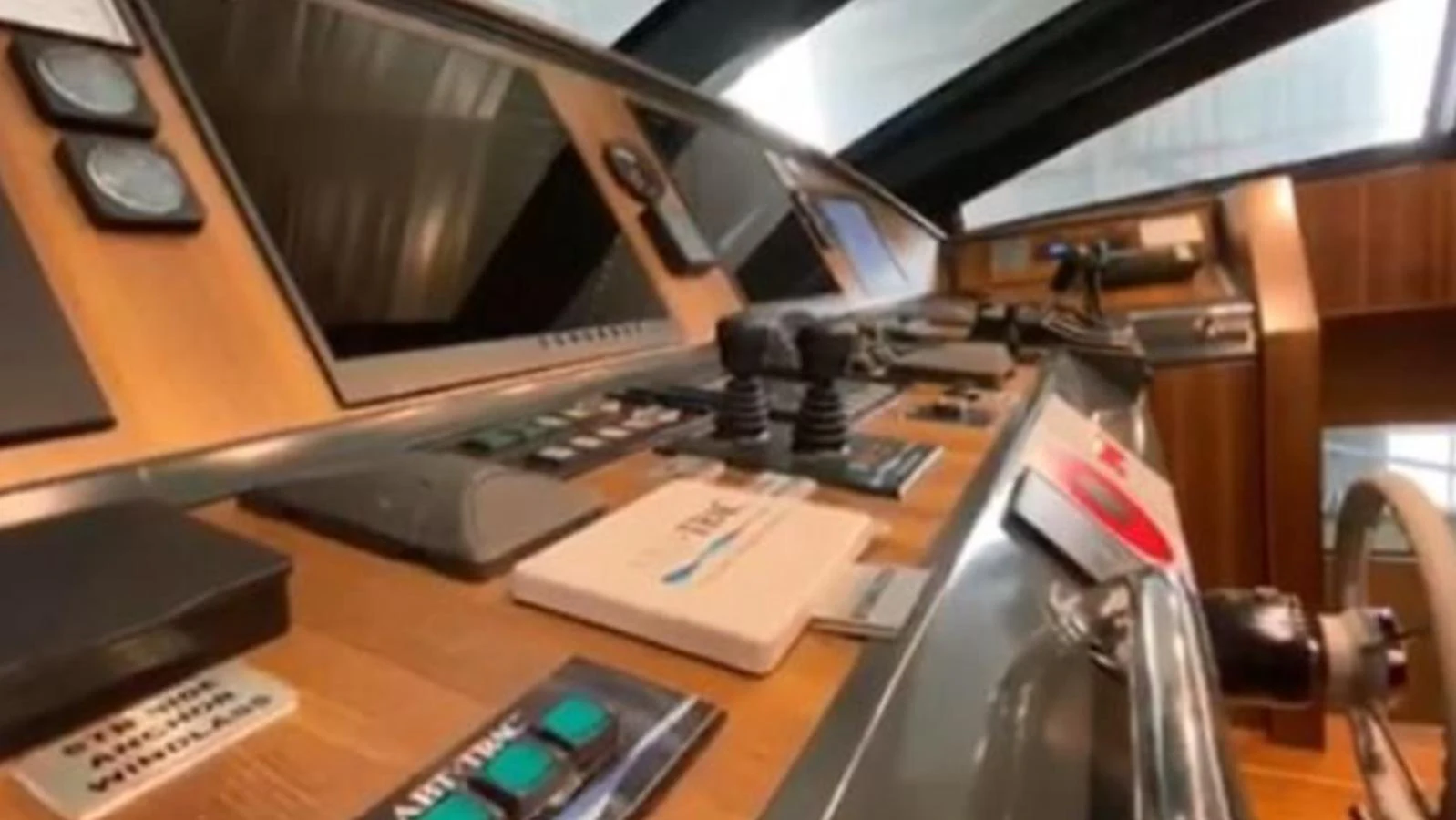 The helm station features advanced navigation equipment and a sleek design. aboard RIVA 115 Yacht for Sale