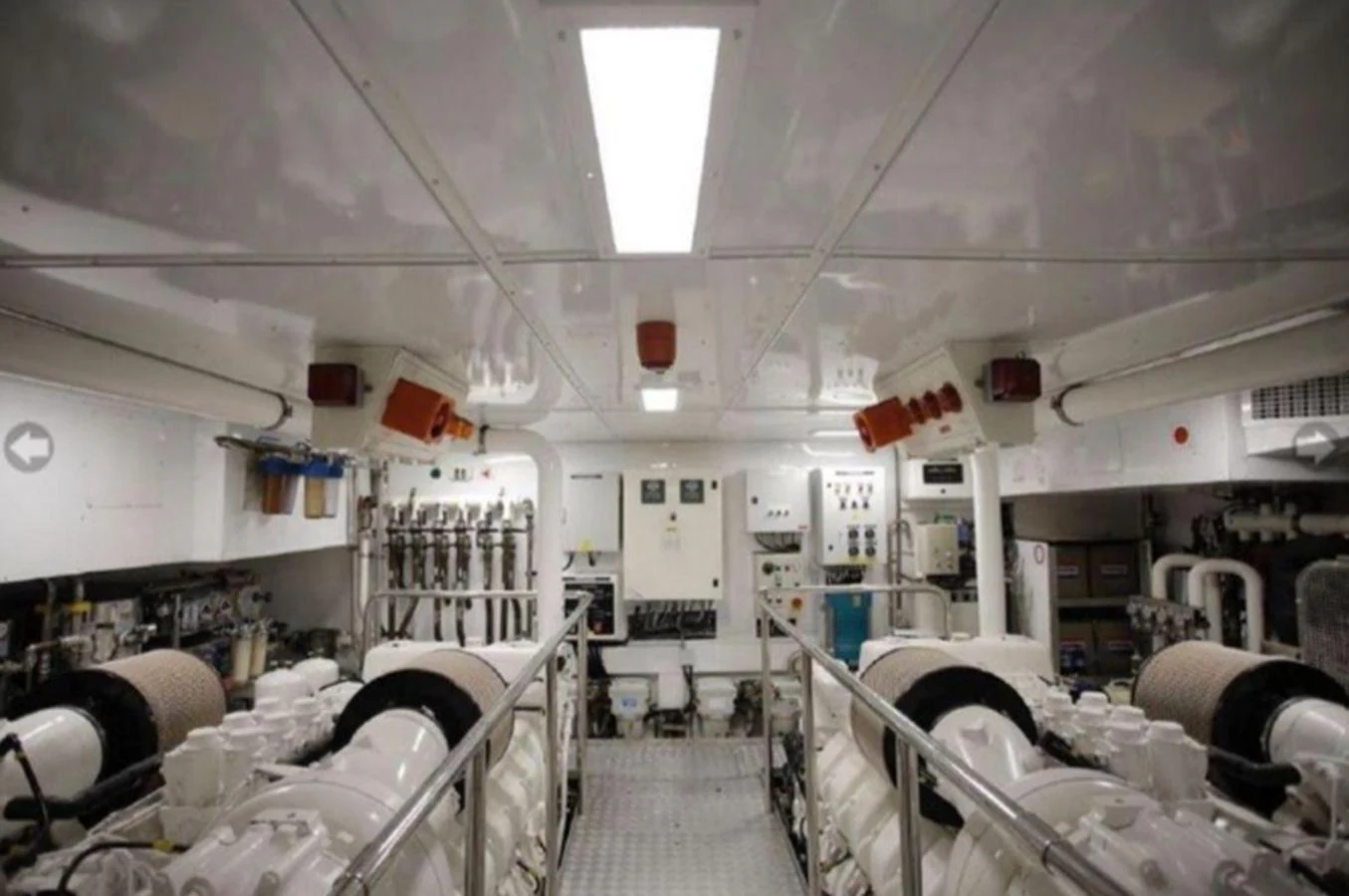 The yacht's engine room showcases advanced machinery and a well-organized layout. aboard RIVA 115 Yacht for Sale