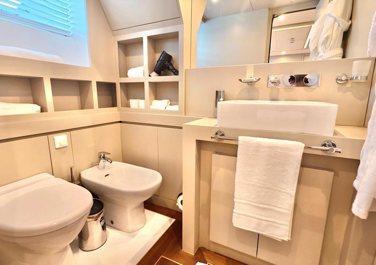 The yacht's bathroom features modern fixtures and a clean, elegant design. aboard RIVA 115 Yacht for Sale