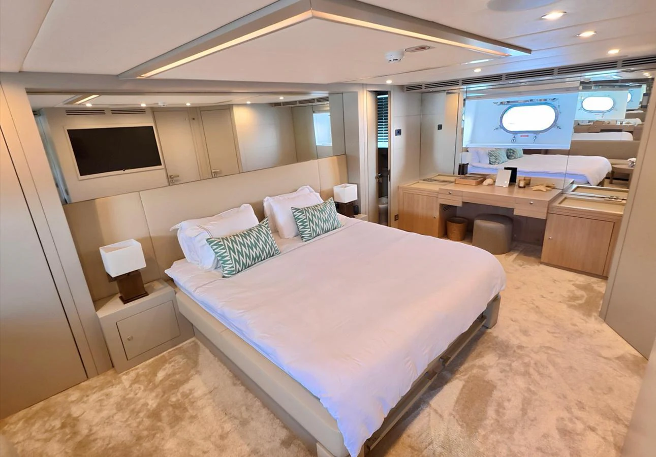 The master stateroom features a spacious bed, elegant decor, and ample natural light. aboard RIVA 115 Yacht for Sale