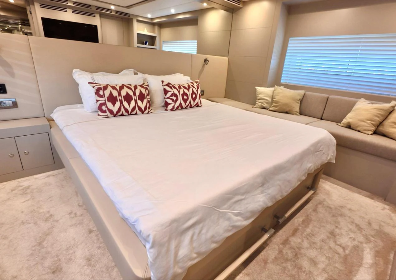 The master stateroom features a spacious bed with elegant decor and ample natural light. aboard RIVA 115 Yacht for Sale