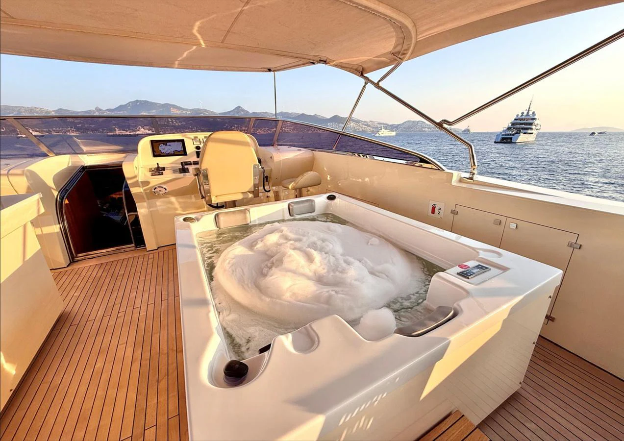 The flybridge features a luxurious hot tub with stunning sea views. aboard RIVA 115 Yacht for Sale