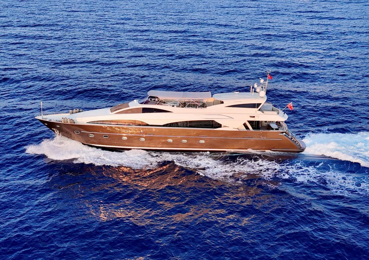 A sleek and modern yacht cruising on the open sea, showcasing its elegant design and luxurious features. aboard RIVA 115 Yacht for Sale